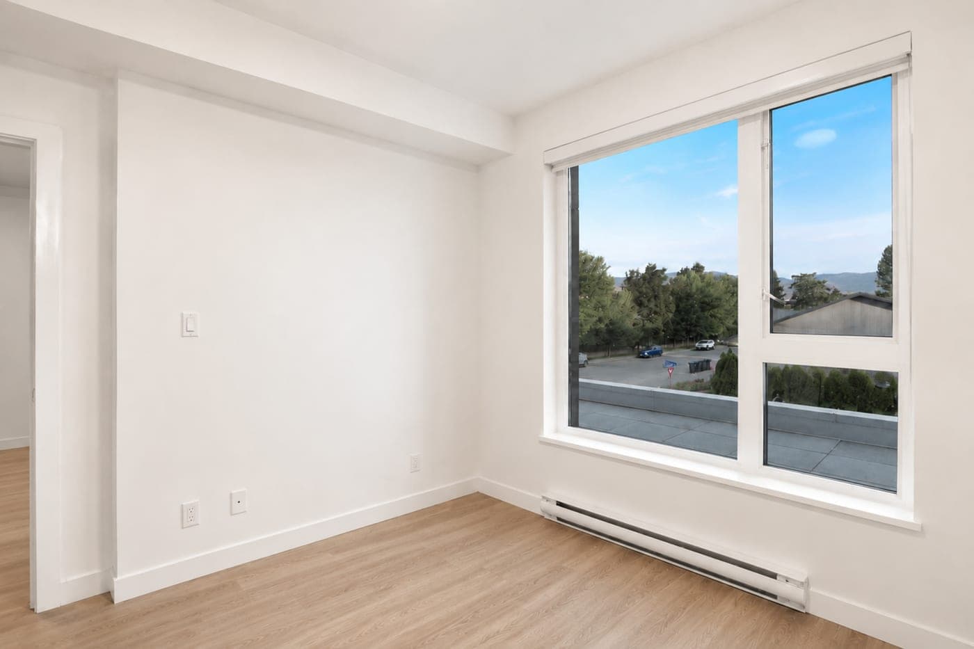Bedroom with a window seat — empty room, before staging