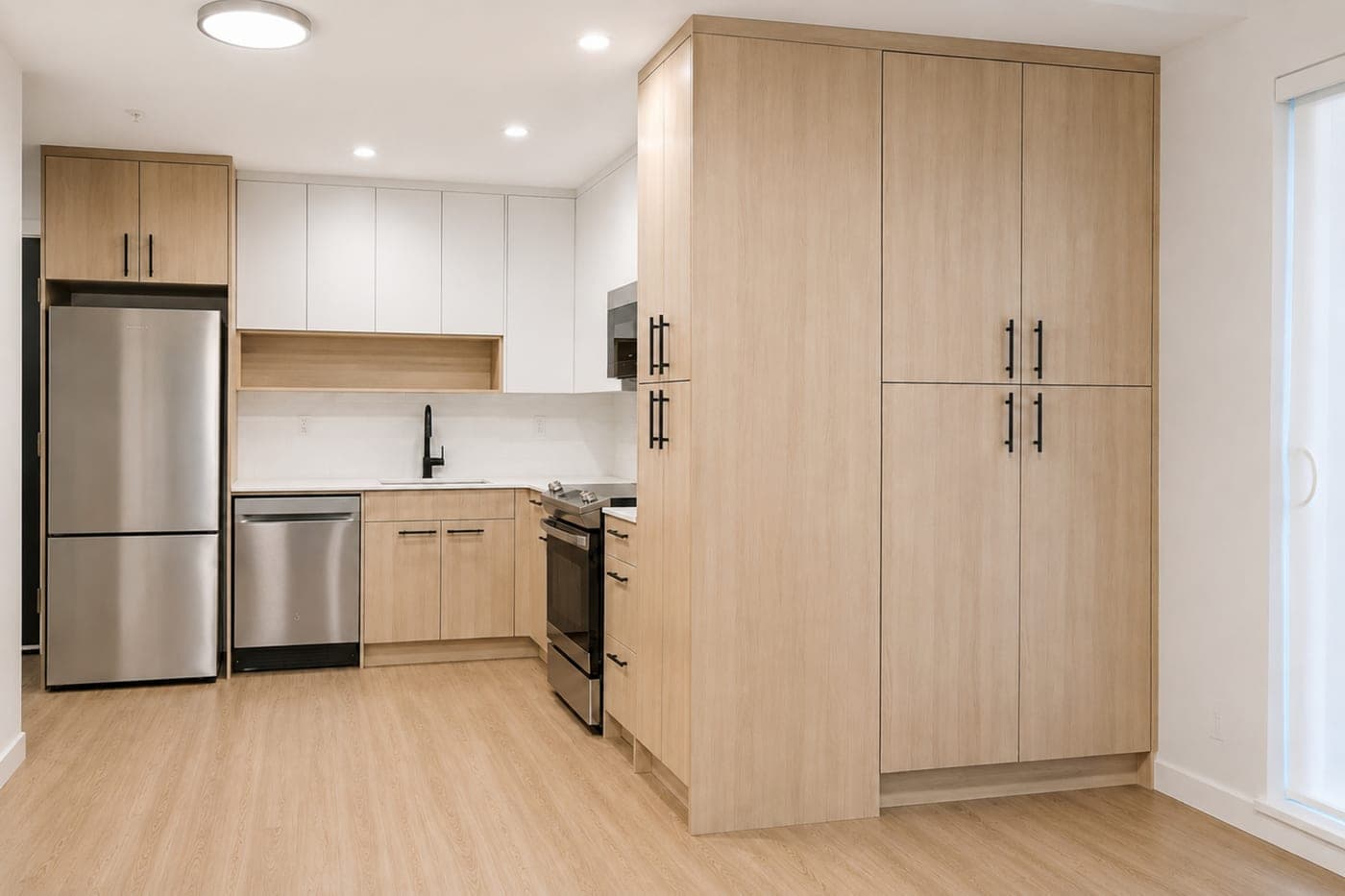 Kitchen with a dining nook — empty room, before staging