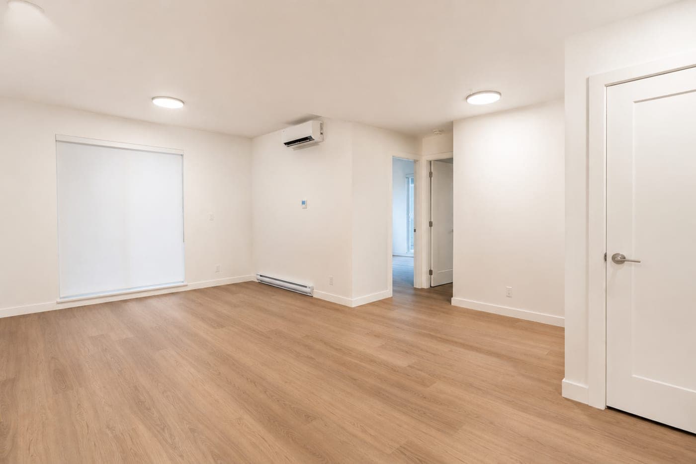 Open living and dining area in a Vancouver condo — empty room, before staging